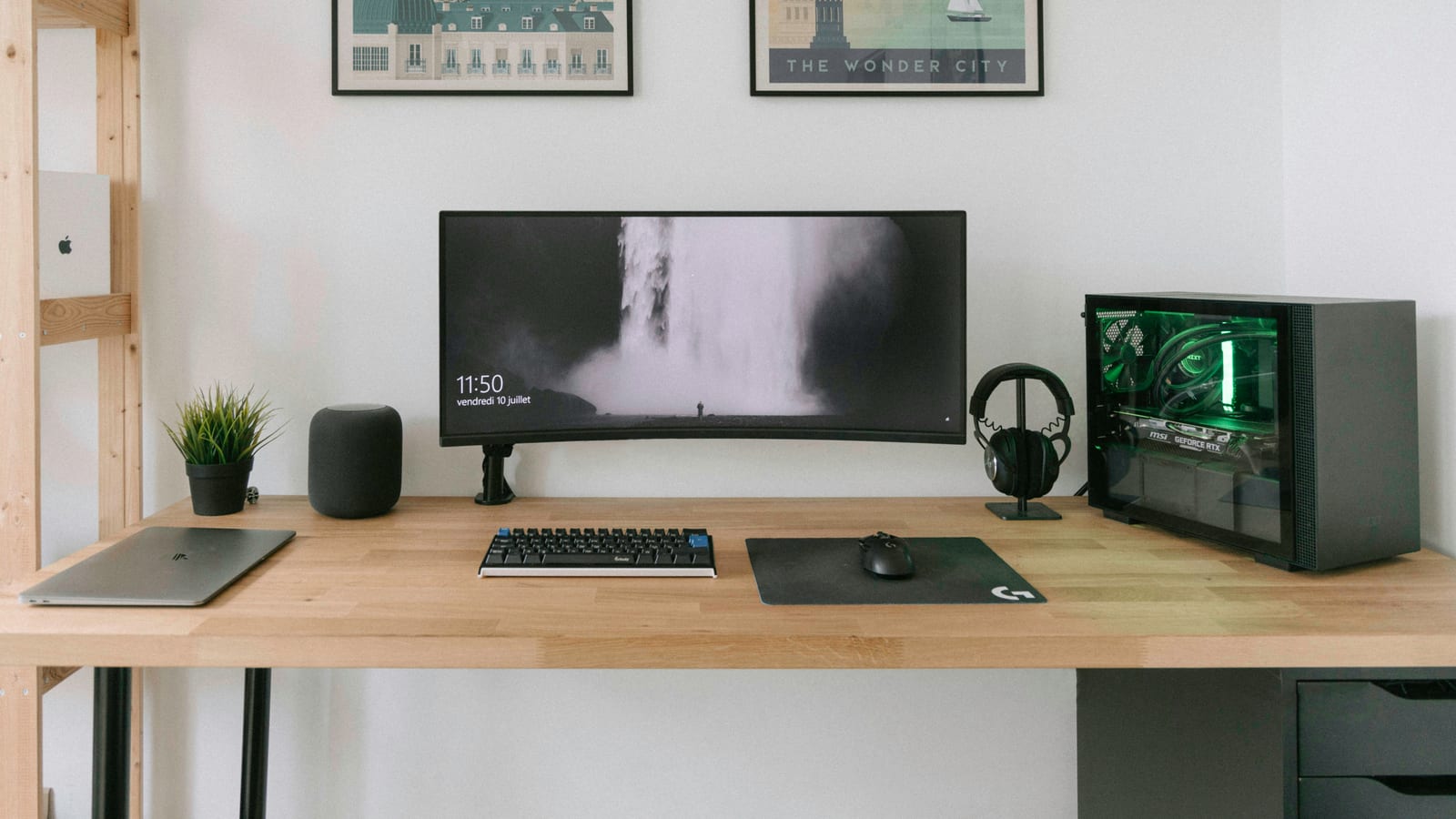 black flat screen computer monitor on brown wooden desk